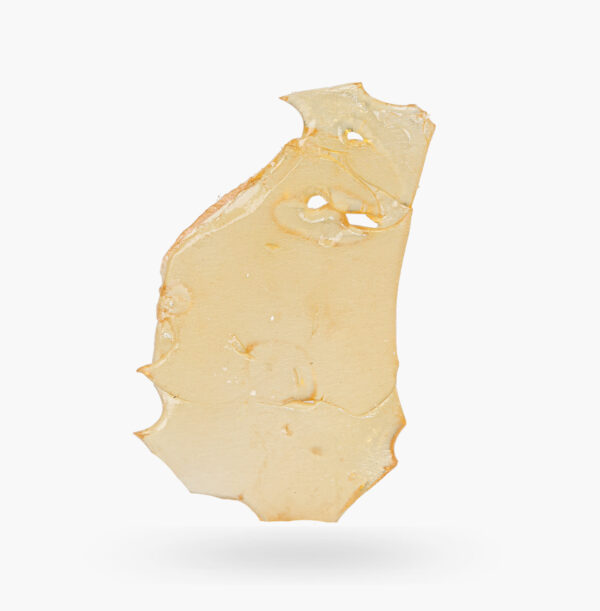 A piece of Pineapple Express shatter produced by Kootenay Labs; it's pale straw coloured and semi-translucent.