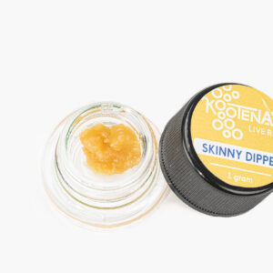 An open 1g jar of Skinny Dipper Live Resin produced by Kootenay Labs; contents are bright gold and creamy in texture.