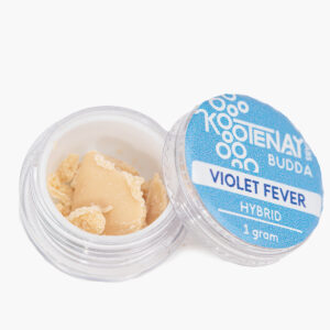 An open 1g jar of Violet Fever budder produced by Kootenay Labs; contents are pale straw coloured and waxy in texture.